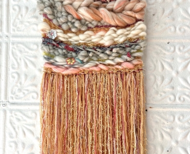 Weaving from textured fabrics in creme, brown and pink